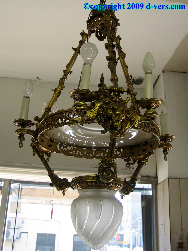 Antique gsd light chandelier with lion's heads 