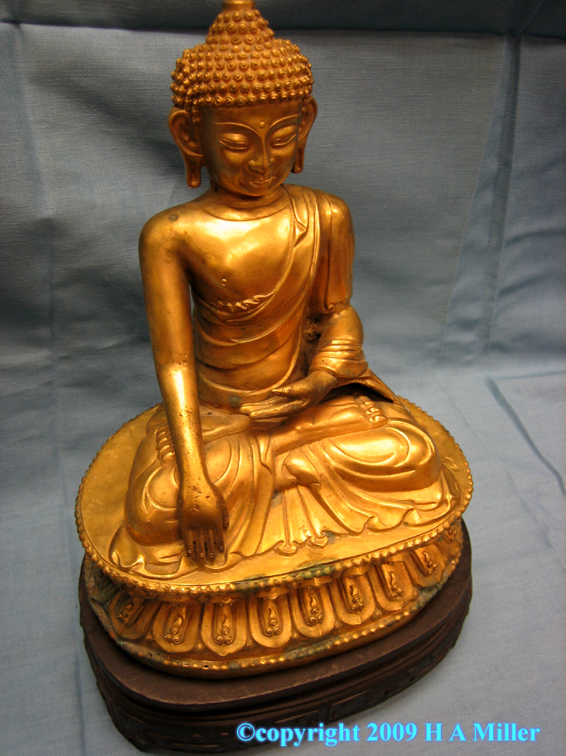 Gilded bronze Buddha statue from China with hand upraised in a gesture of blessing 